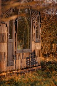an outside view of a house with two windows at Boath Cabin in Auldearn