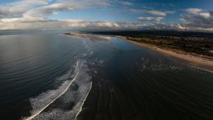 an aerial view of a beach and the ocean at Boath Cabin in Auldearn