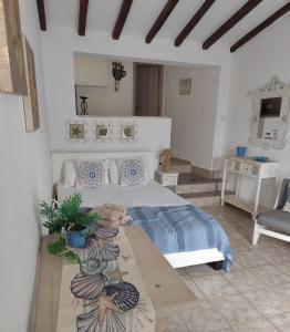 a bedroom with a bed and a table in it at Alexia Studios in Kolios