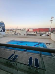 a swimming pool on the roof of a building at Golden Homes 2 in Dubai