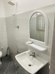 a bathroom with a sink and a mirror at Three D Rooms in Haldummulla +11 photos