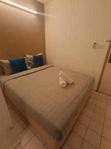 a large bed sitting in a room with at Olio CoLiving Pudu Kuala Lumpur in Kuala Lumpur