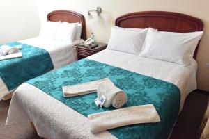 Postel nebo postele na pokoji v ubytování Hotel Makroz + 37 fotografií