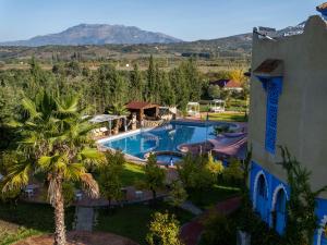 an aerial view of a resort with a swimming pool at Dar Ba Sidi & Spa Chefchaouen in Chefchaouen