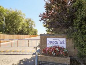 a sign for a driveway park with flowers at Dawson Park 8 - Uk12667 in Mablethorpe +15 photos