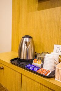 a tea pot sitting on top of a counter at Hotel American inn in Nakodar