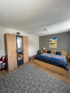 a bedroom with a large bed in a room at 4P Apartment in Andermatt
