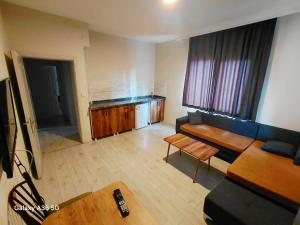 a living room with a couch and a table at Esta123 in Kavaklıdere