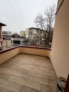 an empty balcony with a view of a city at Boutique Rooms Desi 1 in Pleven