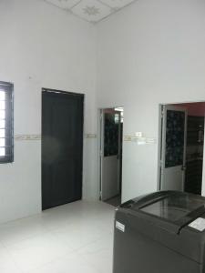 a room with three doors and a trash can at Mây homestay Phan Rang in Bắc Sớn
