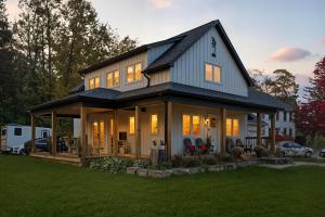 a large house with a gambrel roof at Redwood Suite - NOTL Prime Location GETAWAY in Niagara-on-the-Lake