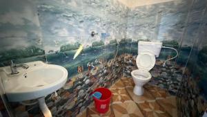 a bathroom with a sink and a toilet at Tapama Resort Bakkhali in Bakkhali +87 photos