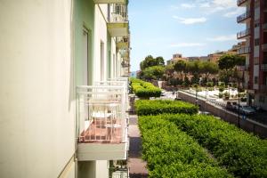 a balcony of a building with a view of a street at La Casa di Hera in Crotone