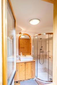 a bathroom with a sink and a shower at Sruby Peřeje in Ostravice