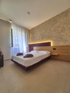 a bedroom with a large bed in a room at La Casa di Hera in Crotone