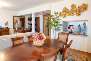 a dining room with a table and chairs at Quinta das Mineirinhas in Vila Nova de Cerveira