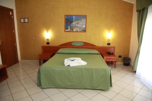 Posteľ alebo postele v izbe v ubytovaní Hotel Dorè