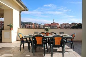 a table and chairs on a balcony with a view at WI-RO Risorgimento,9 - La Perla di Andora in Marina di Andora