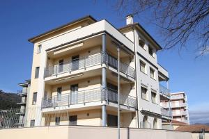 a white building with balconies on top of it at WI-RO Risorgimento,9 - La Perla di Andora in Marina di Andora