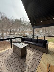 a couch sitting on a patio with a table at Sandstone Lodge in Stanton