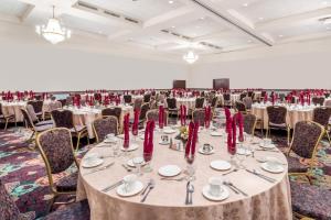 a large banquet hall with tables and chairs at Ramada by Wyndham State College Hotel & Conference Center in State College +51 photos