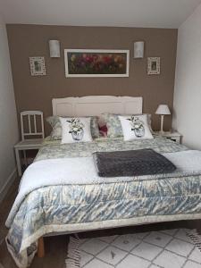 a bedroom with a large bed with pillows at Magnolia in Trois-Palis +19 photos