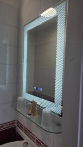 a bathroom with a mirror and a sink at The Devonshire House Hotel-Free Parking in Liverpool +59 photos