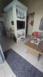 a living room with a couch and a table at Atlantic Wave Villa in Aguada