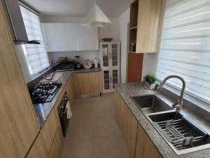 a kitchen with a sink and a counter top at Damani Modern Pool Villa Escape in Punta Cana