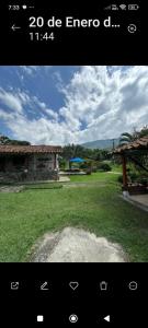 a screenshot of a picture of a yard with a house at Ingenia Casa Hostal in Palmira