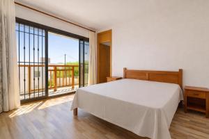 a bedroom with a bed and a large window at Hope Villa in Calodyne