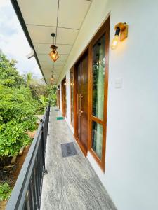 a walkway leading to the front door of a house at Diyathna Nuwarawewa in Anuradhapura