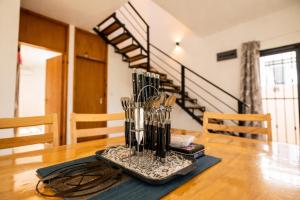 a dining room table with a tray of utensils on it at Hope Villa in Calodyne +5 photos