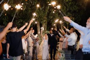 a bride and groom walking down the aisle at their wedding at Pousada Villa da Serra in Brumadinho +39 photos