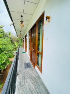 a corridor of a house with a balcony at Diyathna Nuwarawewa in Anuradhapura +7 photos