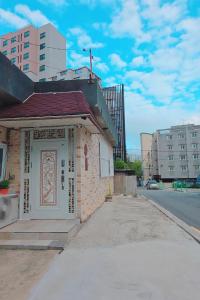 a small brick building on the side of a street at Traditional Korean houses Stay Yeon in Busan