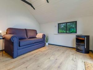 a living room with a couch and a tv at 2 Bed in Penzance oc-85610 in St. Just