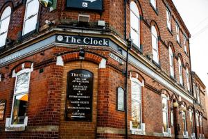 a brick building with a clock on the side of it at City-Centre Studio · Self-Contained · Sleeps 3 in Nottingham
