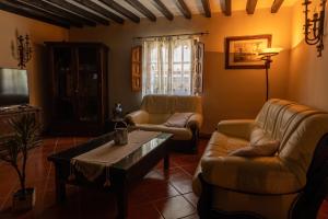 a living room with two couches and a coffee table at La casona de la alberca in La Alberca