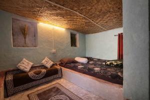 a bedroom with two beds in a room at The Gypsy Soul Mukteshwar in Mukteshwar