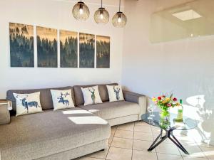 a living room with a couch and a glass table at Apartment Feingeist by Interhome in Löffingen