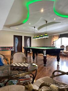 a living room with a pool table in it at Cottage EcoComfort in Sagunovka +30 photos