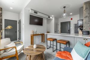a living room with a couch and a table at Park Hotel 1BR Suite 402 in Chattanooga +20 photos