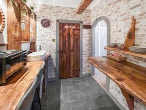 a kitchen with a wooden counter top and a door at Marton Lodge in Bridlington