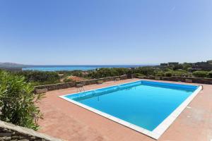 a swimming pool in a villa with a view at L10 Terrazza Ponente A breathtaking view in Stintino