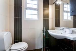 a bathroom with a toilet and a sink at Villa Santana by GALMI in Santana +23 photos