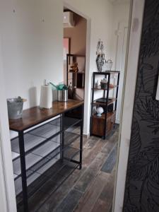 a room with a desk and a mirror at Maison du causse in Magalas
