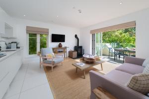 a living room with a couch and a table at Tors Park in Lynmouth