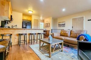 a living room with a couch and a table at Rustic Ridge MH304 Near Powder Mtn Hot Tub in Eden +82 photos