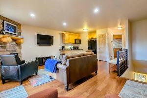 a living room with a couch and chairs and a kitchen at Rustic Ridge MH304 Near Powder Mtn Hot Tub in Eden